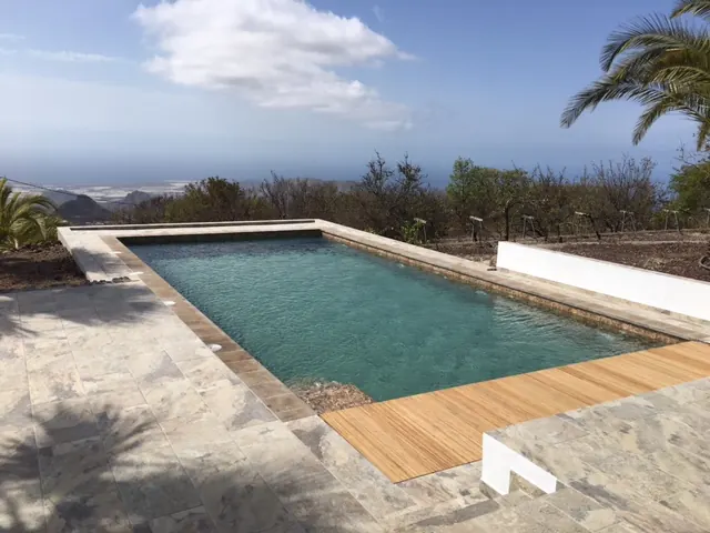 Swimming pool with a timber deck beside a villa in the Tenerife hills Swimming pool with a timber deck beside a villa in the Tenerife hills