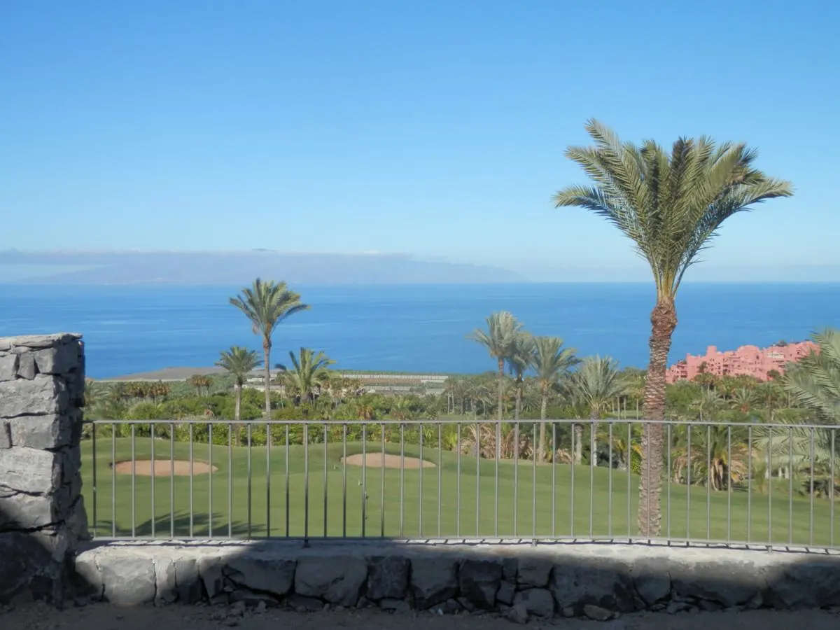 Sea and golf course views from a villa garden in Tenerife