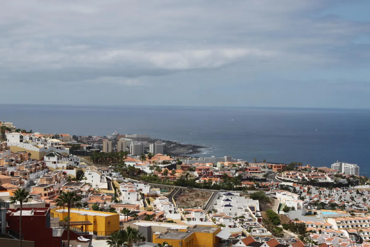 Rooftops of a coastal town in south Tenerife with the sea beyond Rooftops of a coastal town in south Tenerife with the sea beyond