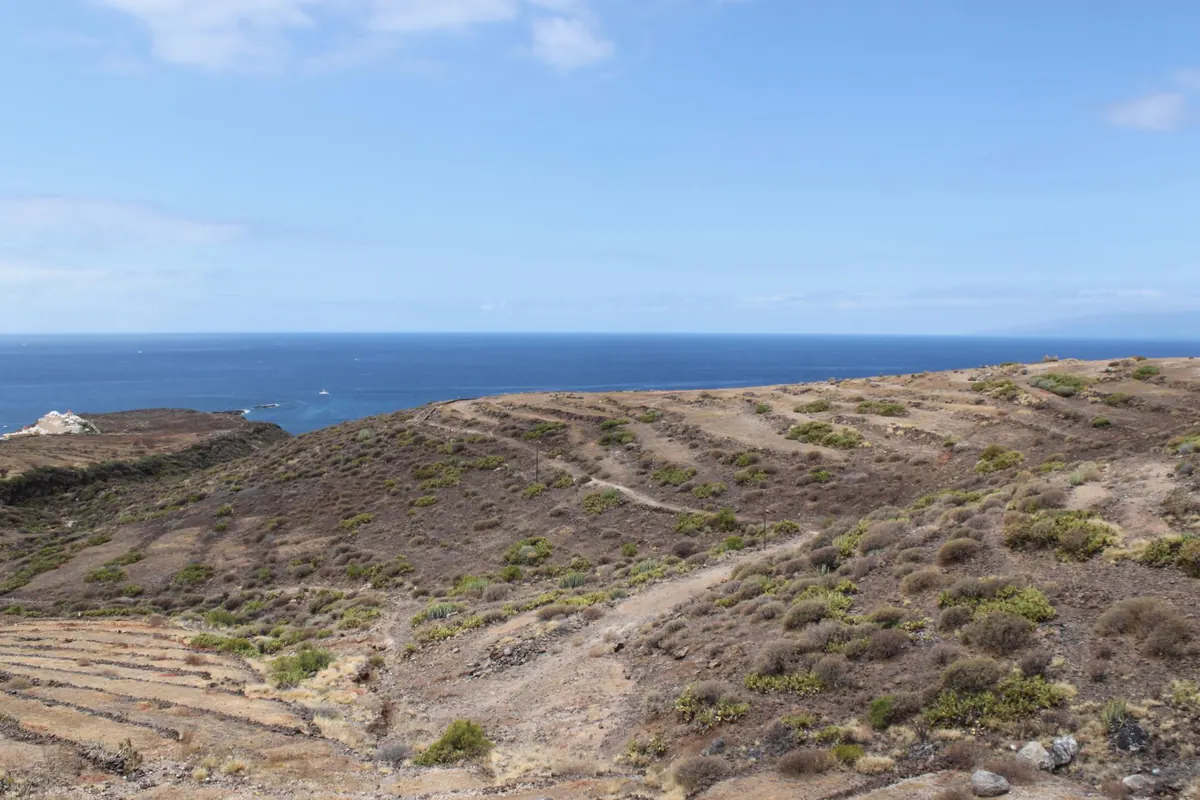 Dry volcanic hillside above the sea on the south coast of Tenerife